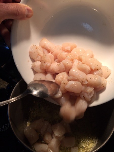 Scallops added to pan