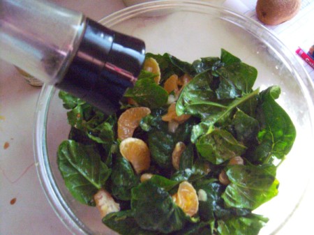 adding pepper to salad