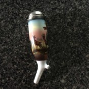 Identifying a Porcelain Container - tall narrow porcelain container with silver lid, pipette at bottom and images of deer around the top