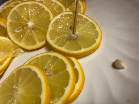 removing seeds from lemon slices