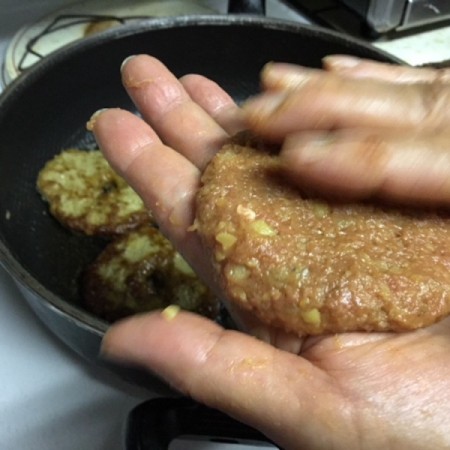 patting ball of ingredients