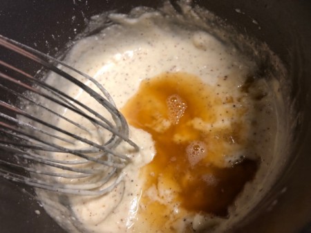 adding cognac to butter and sugar
