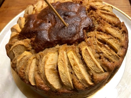 poking with wooden skewers into Apple Walnut Cognac Cake