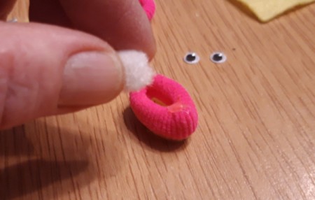 Teeny Tiny Dolly Slippers - use glue to stick the pom pom where you took the stitches