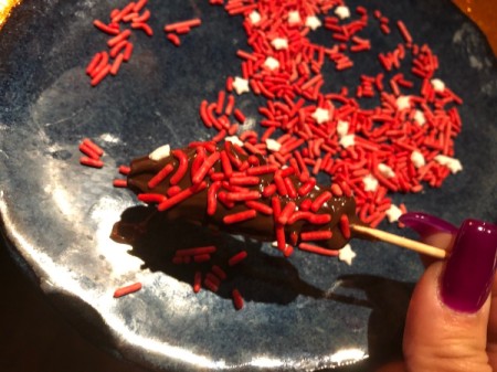 Chocolate Swedish Fish dipped in sprinkles