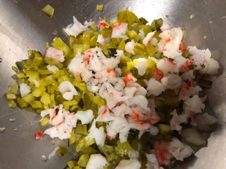 diced pickles and crab in bowl