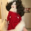 Identifying a Porcelain Skater Doll - ice skater doll wearing a red dress and hat trimmed with white fur