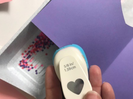 Repurpose Victoria's Secret Shopping Bag for Valentine's Day - using a hole punch to make paper hearts and dots