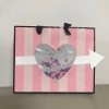 Repurpose Victoria's Secret Shopping Bag for Valentine's Day - cute pink and white striped shopping bag repurposed into a Valentine's Day gift bag