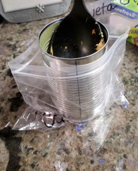 A can inside a ziptop bag, for use in filling.