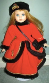 Value of a 16" Porcelain Vanessa Doll - doll wearing a red coat and dress trimmed with black and a black hat
