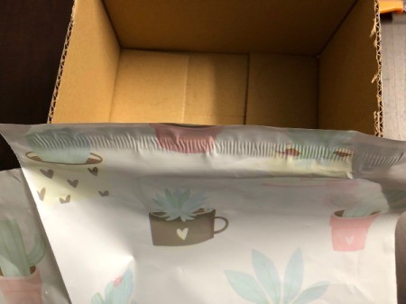 Recycled Cardboard Box Valentine's Day Mailbox - begin wrapping with your choice of covering, here a poly mailer is used