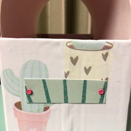 Recycled Cardboard Box Valentine's Day Mailbox - attach to the side of the box with brads, you can write the family or child's name here
