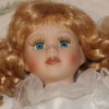 Value of a Porcelain Doll - face of a porcelain doll with blond curls