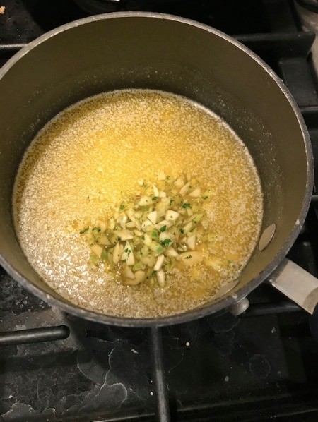 garlic added to melted butter