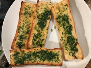 Herb and Garlic Bread Spread on bread