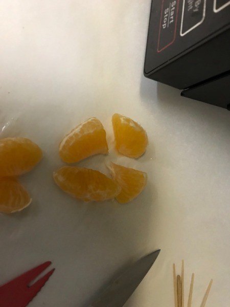 Cut clementines segments in half