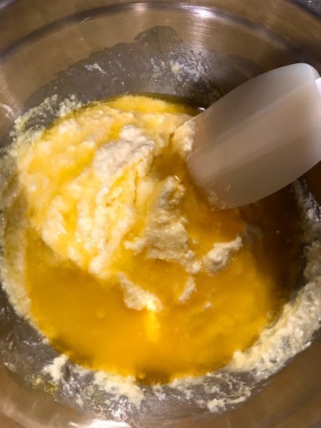 adding butter to batter