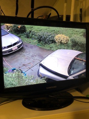 A security camera showing two cars.