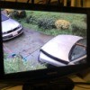 A security camera showing two cars.