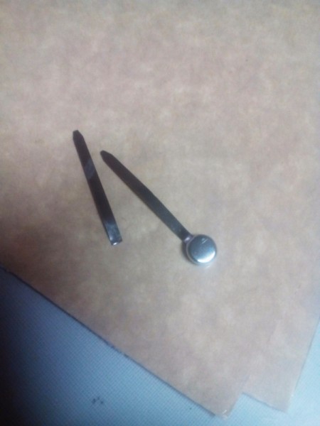 Handcrafted Notebook and Planner - detach the arms of the fastener from the head