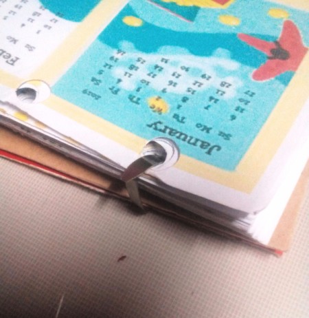 Handcrafted Notebook and Planner - insert the rings into the punched holes