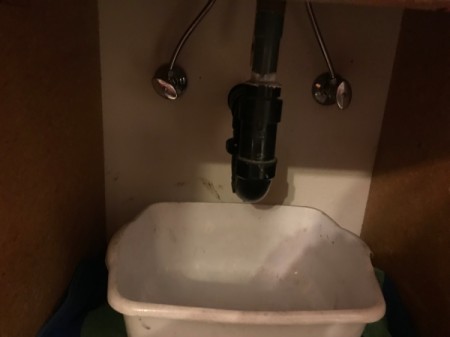 Placing a dishpan under the ptrap to catch any liquid.