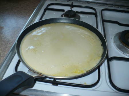 cooking crepe in pan
