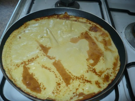 flipped crepe in pan