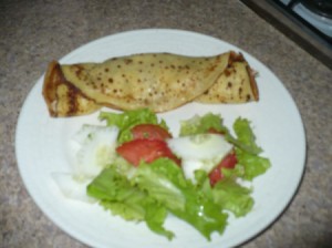 Crepe and salad on plate