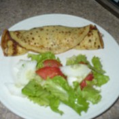 Crepe and salad on plate