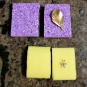 Jewelry protected between two pieces of sponge.