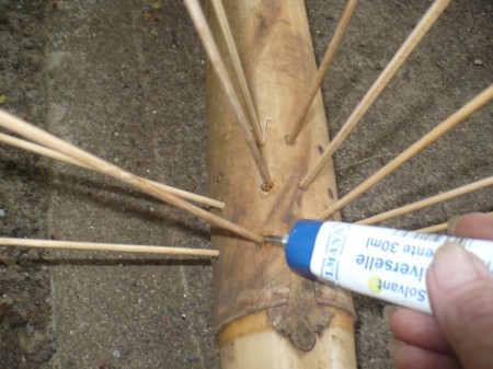 Making a Bamboo Rainstick - add a drop of glue to seal each hole
