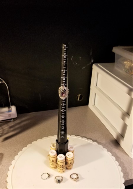 Support a Ring Mandrel with Corks - glue raffia around the corks and tie for extra strength