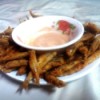 Fish Fries with bowl of sauce on plate