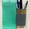 Making a Magnetic Pen/Pencil Holder - pen holder next to note pad on fridge