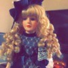 Identifying Porcelain Dolls - doll wearing dark blue satin and lace dress