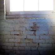 Basement brick wall and window edge.