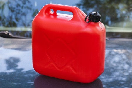 Gas can on the car hood.