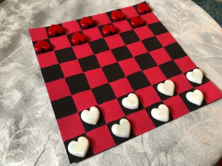 Valentine's Checkers Game - place heart pieces on black squares and now you are ready to play