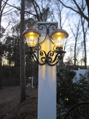 Decorative Outdoor Solar Sconces - lights on as twlight begins