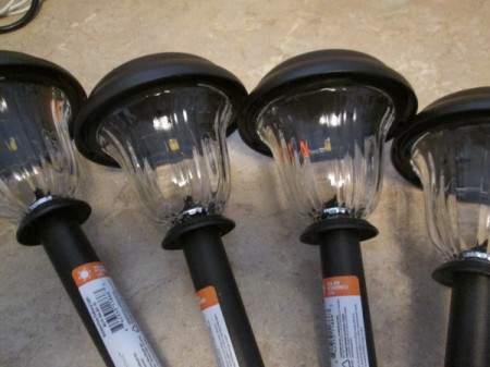 Decorative Outdoor Solar Sconces - inexpensive solar lights still mounted to stakes