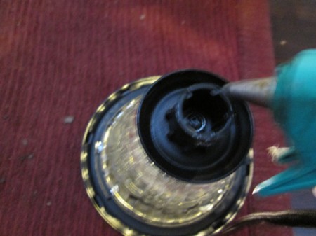 Decorative Outdoor Solar Sconces - solar light removed and hot glue being added to the stake mounting area