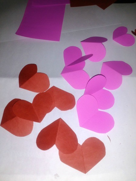 Making a Paper Valentine Tree - cut out hearts from pink and red paper