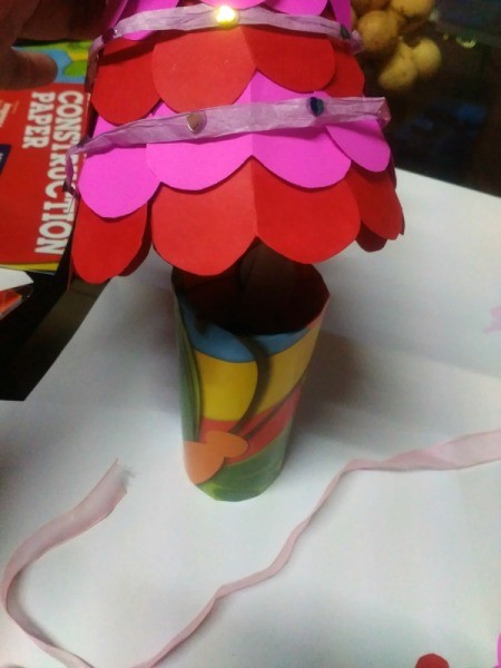 Making a Paper Valentine Tree - place the cone over the paper roll and your tree is done
