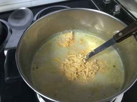 adding cheese to Chowder