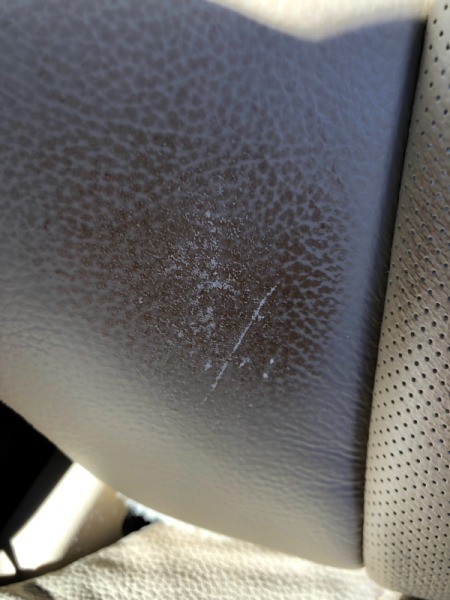 Stain on Leather Car Seat from Belt