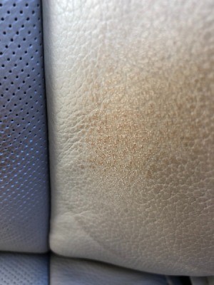 Stain on Leather Car Seat from Belt - closeup of the stain