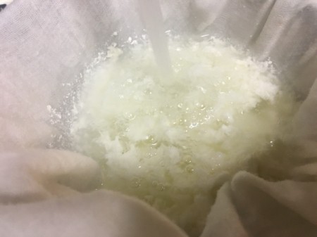 straining curds from whey