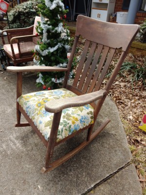 Value of a Murphy Rocking Chair - dark wood rocking chair with floral cushion